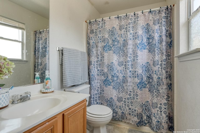 bathroom with tile patterned floors, curtained shower, toilet, and vanity