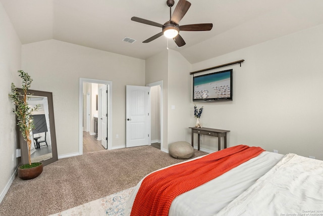 carpeted bedroom with baseboards, visible vents, vaulted ceiling, and a ceiling fan