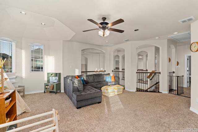 carpeted living area with recessed lighting, visible vents, and baseboards