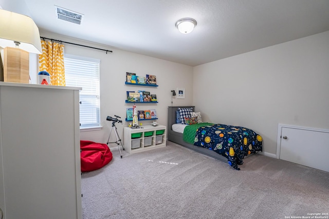 bedroom featuring carpet floors, baseboards, and visible vents