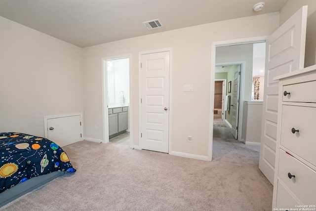 unfurnished bedroom with visible vents, ensuite bath, light carpet, and baseboards