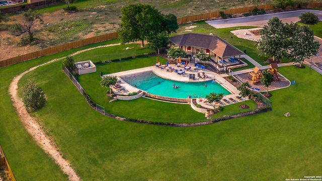 view of swimming pool with fence and a patio