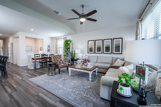 living room featuring ceiling fan, recessed lighting, visible vents, baseboards, and dark wood finished floors