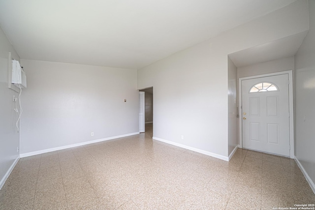 foyer entrance with baseboards and tile patterned floors