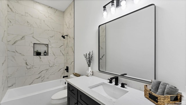 bathroom featuring vanity, shower / tub combination, and toilet