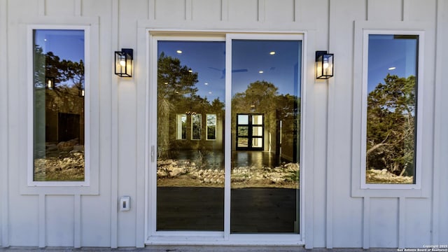 entrance to property featuring board and batten siding