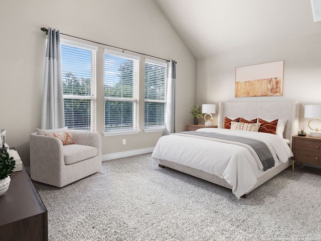 bedroom featuring lofted ceiling, carpet floors, and baseboards