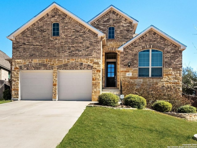 french country inspired facade with driveway, brick siding, a front lawn, and an attached garage