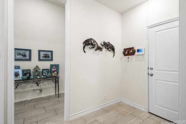 interior space with wood tiled floor and baseboards