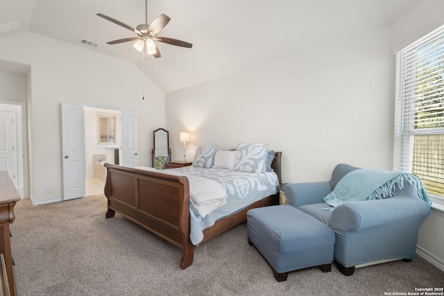 bedroom featuring visible vents, a ceiling fan, connected bathroom, lofted ceiling, and carpet flooring