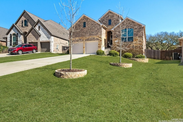 view of front of house with driveway, brick siding, a front lawn, and fence