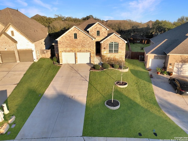 view of front facade with central AC unit, brick siding, fence, concrete driveway, and a front yard