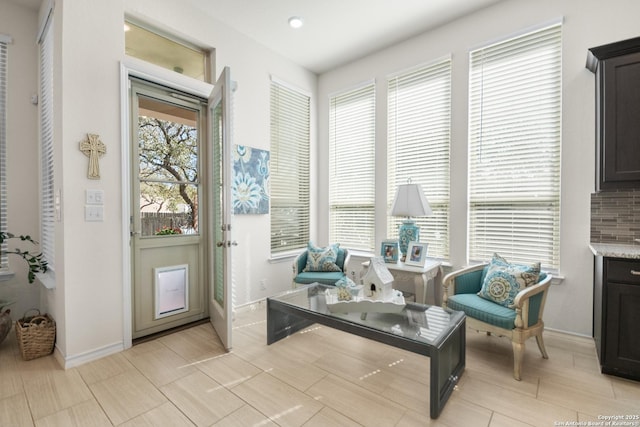 sitting room featuring baseboards