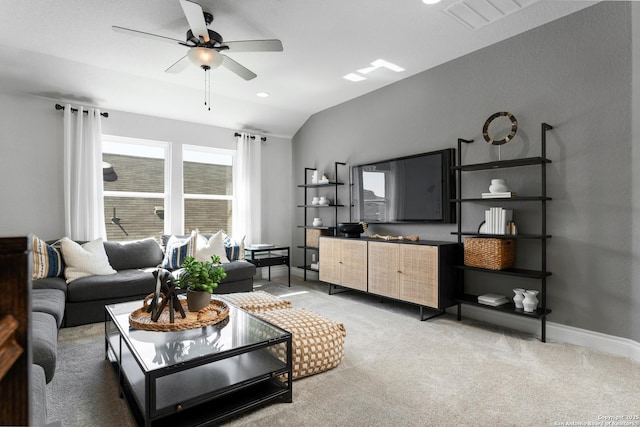 living area featuring lofted ceiling, visible vents, light carpet, ceiling fan, and baseboards