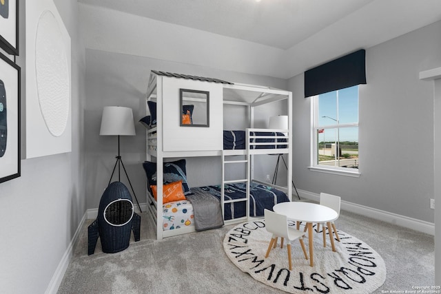 bedroom featuring baseboards and carpet flooring