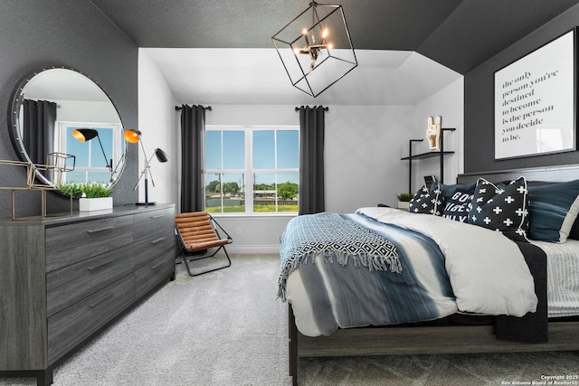 bedroom with carpet, baseboards, and vaulted ceiling