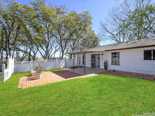 view of yard featuring a patio area and fence