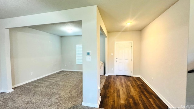 interior space with carpet floors and baseboards