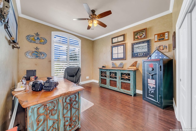 office featuring ceiling fan, crown molding, baseboards, and wood finished floors