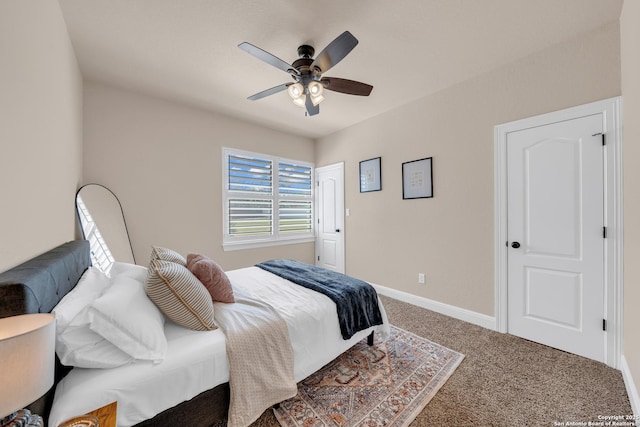 carpeted bedroom featuring ceiling fan and baseboards