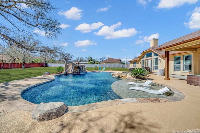 view of swimming pool featuring a yard, a fenced in pool, a fenced backyard, and a patio