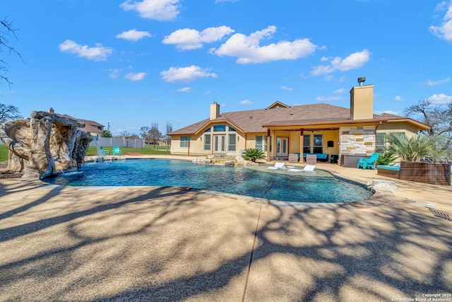 view of pool featuring a patio area, fence, outdoor lounge area, and a fenced in pool