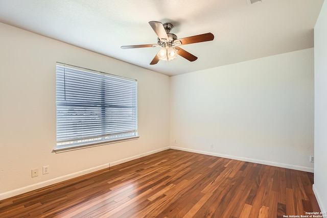 unfurnished room featuring a ceiling fan, baseboards, and hardwood / wood-style floors