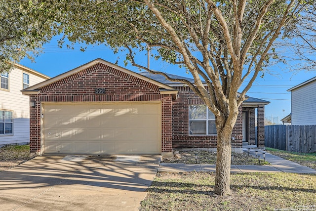 single story home with a garage, brick siding, fence, and driveway