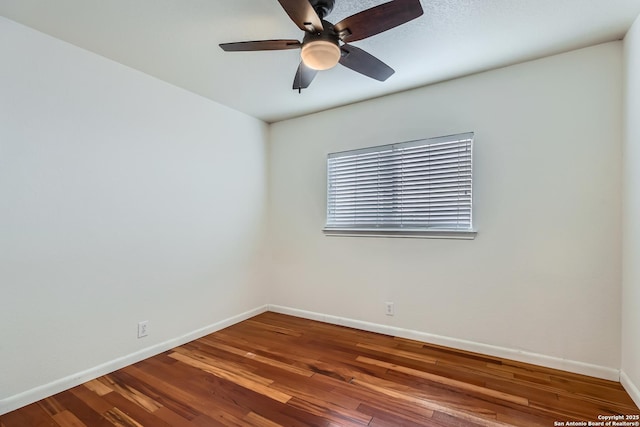 unfurnished room featuring ceiling fan, baseboards, and wood finished floors