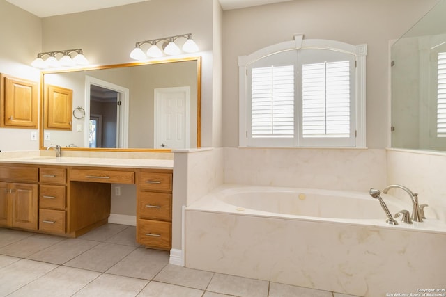 full bathroom featuring vanity, a bath, and tile patterned floors