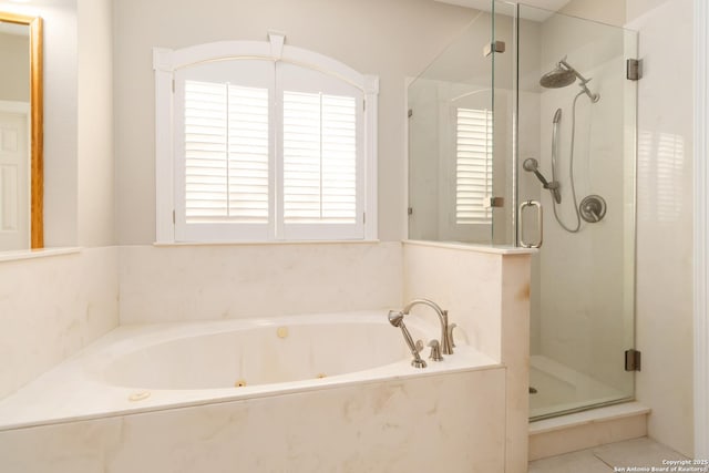 full bath featuring a whirlpool tub and a shower stall