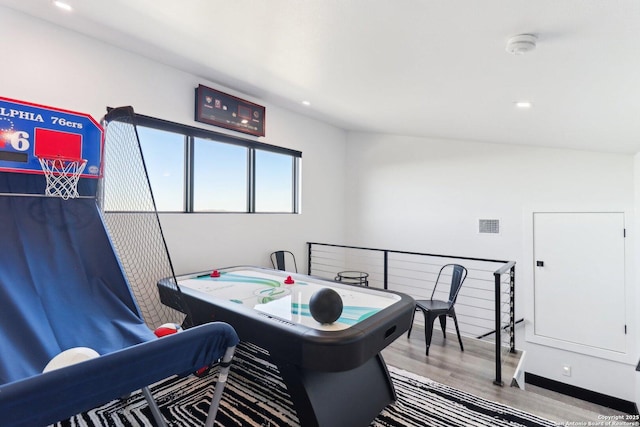 game room featuring recessed lighting, baseboards, and wood finished floors