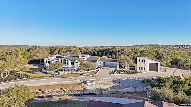 drone / aerial view featuring a forest view