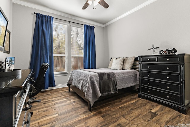 bedroom with ornamental molding, dark wood finished floors, and a ceiling fan