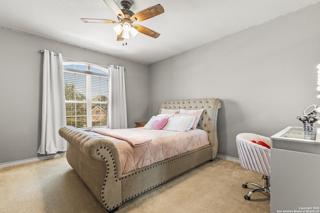 bedroom with carpet, baseboards, and a ceiling fan