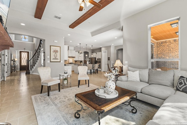 living room with light tile patterned floors, visible vents, stairs, beam ceiling, and recessed lighting