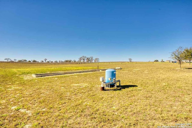 view of yard with a rural view