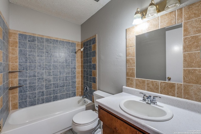 full bath featuring a textured wall, toilet, bathing tub / shower combination, a textured ceiling, and vanity