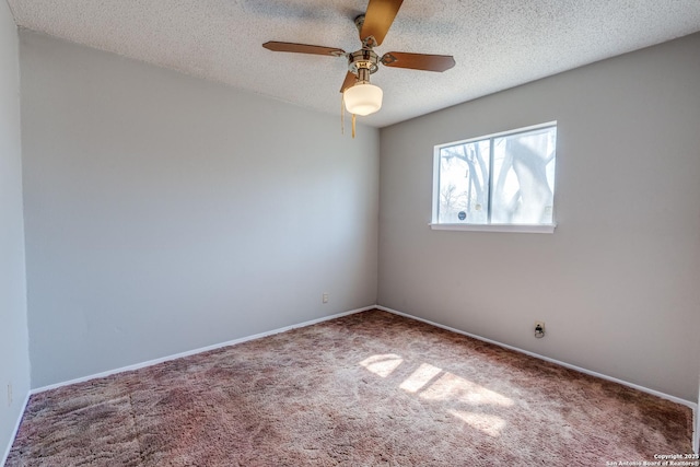 spare room with a textured ceiling, ceiling fan, carpet, and baseboards