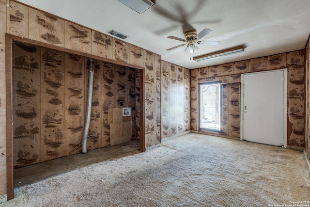 spare room with a ceiling fan and visible vents