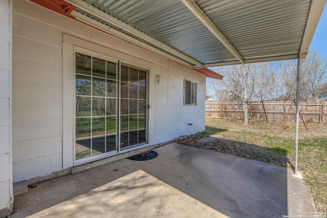 view of patio featuring fence