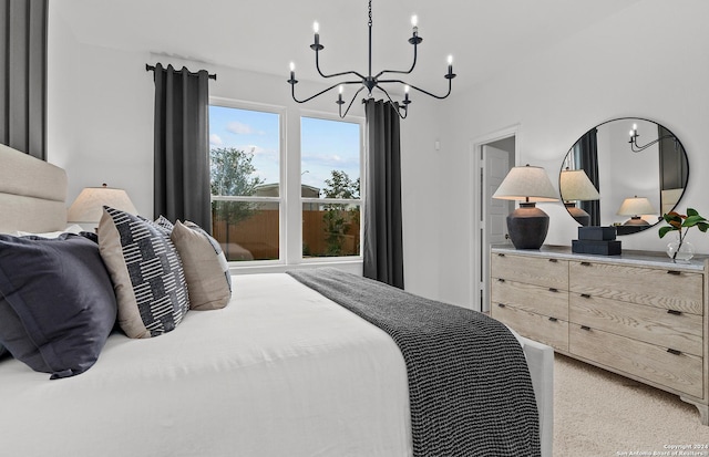 bedroom featuring light carpet and a chandelier