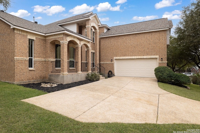 view of front of property with a garage, covered porch, concrete driveway, and brick siding