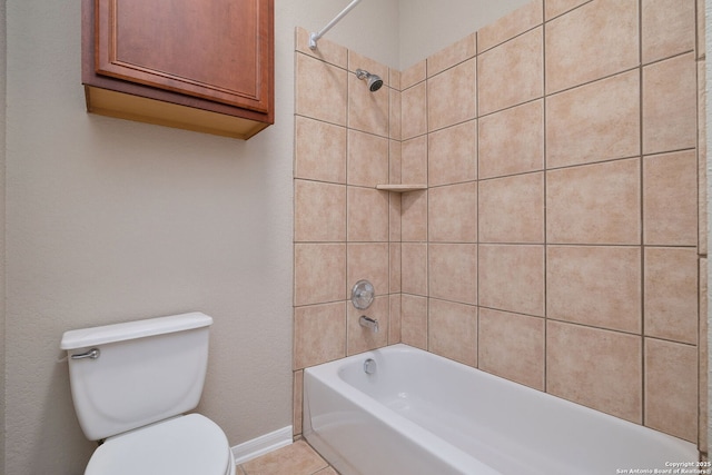 bathroom featuring toilet, baseboards, shower / washtub combination, and tile patterned floors