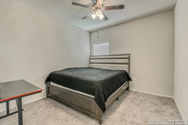 carpeted bedroom featuring a textured ceiling, a textured wall, and baseboards