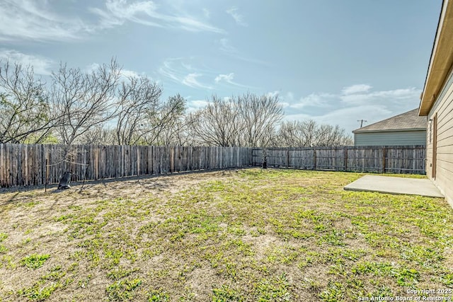 view of yard featuring a fenced backyard and a patio