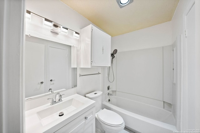 bathroom featuring bathing tub / shower combination, vanity, and toilet