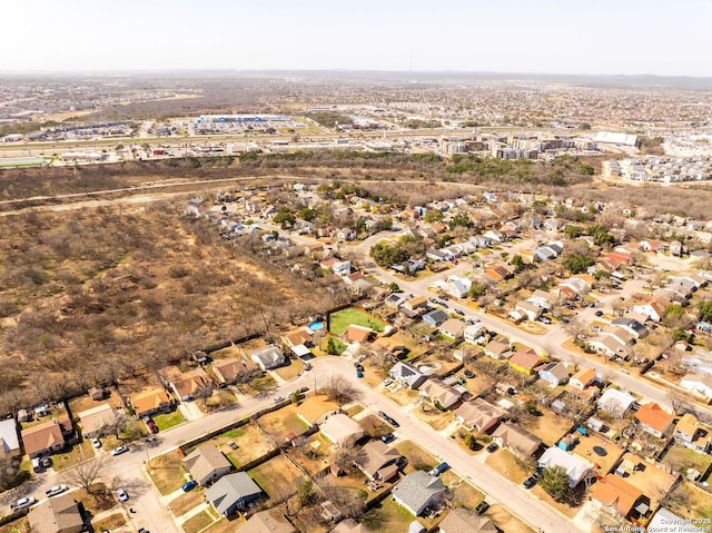 birds eye view of property with a residential view