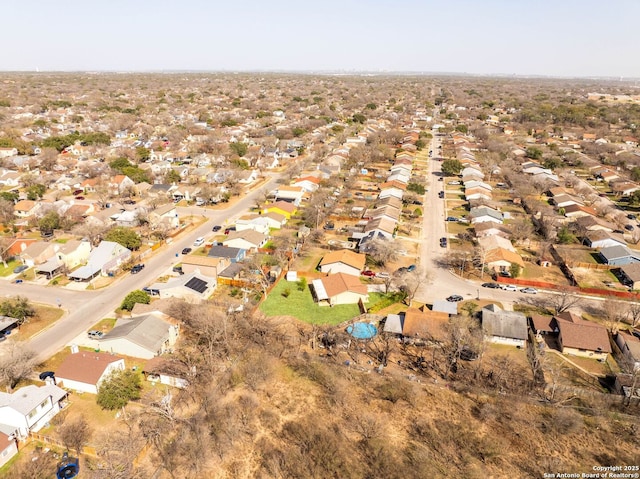 birds eye view of property with a residential view