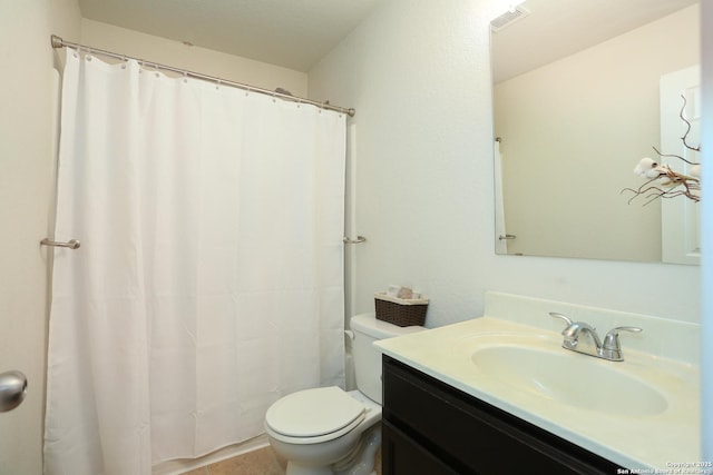 full bath featuring visible vents, vanity, and toilet